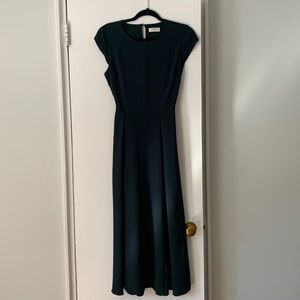 Like new deep green Babaton dress. Beautiful open back detail. Great for spring